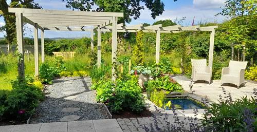 The garden now landscaped with percola and seating area