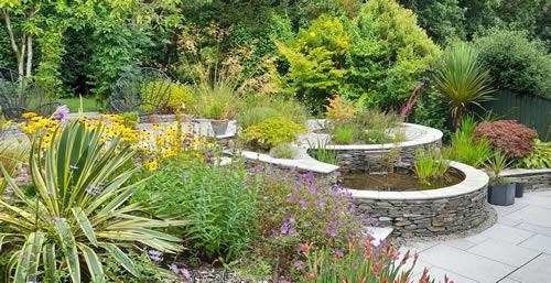 Pool and planted borders in a landscaped garden