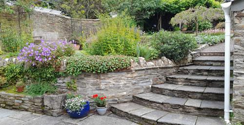 Curved steps leading to a garden courtyard