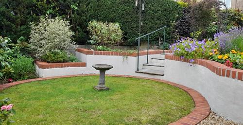 Landscaped garden in Plympton with raised beds